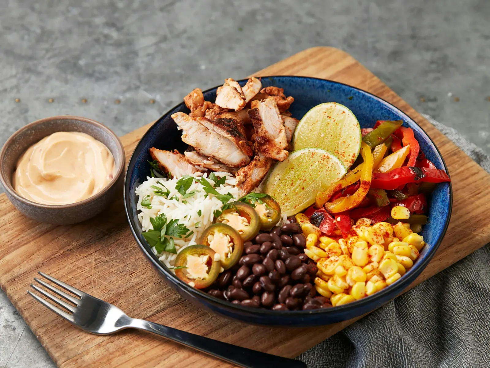 Chicken burrito bowl with black beans, corn and rice