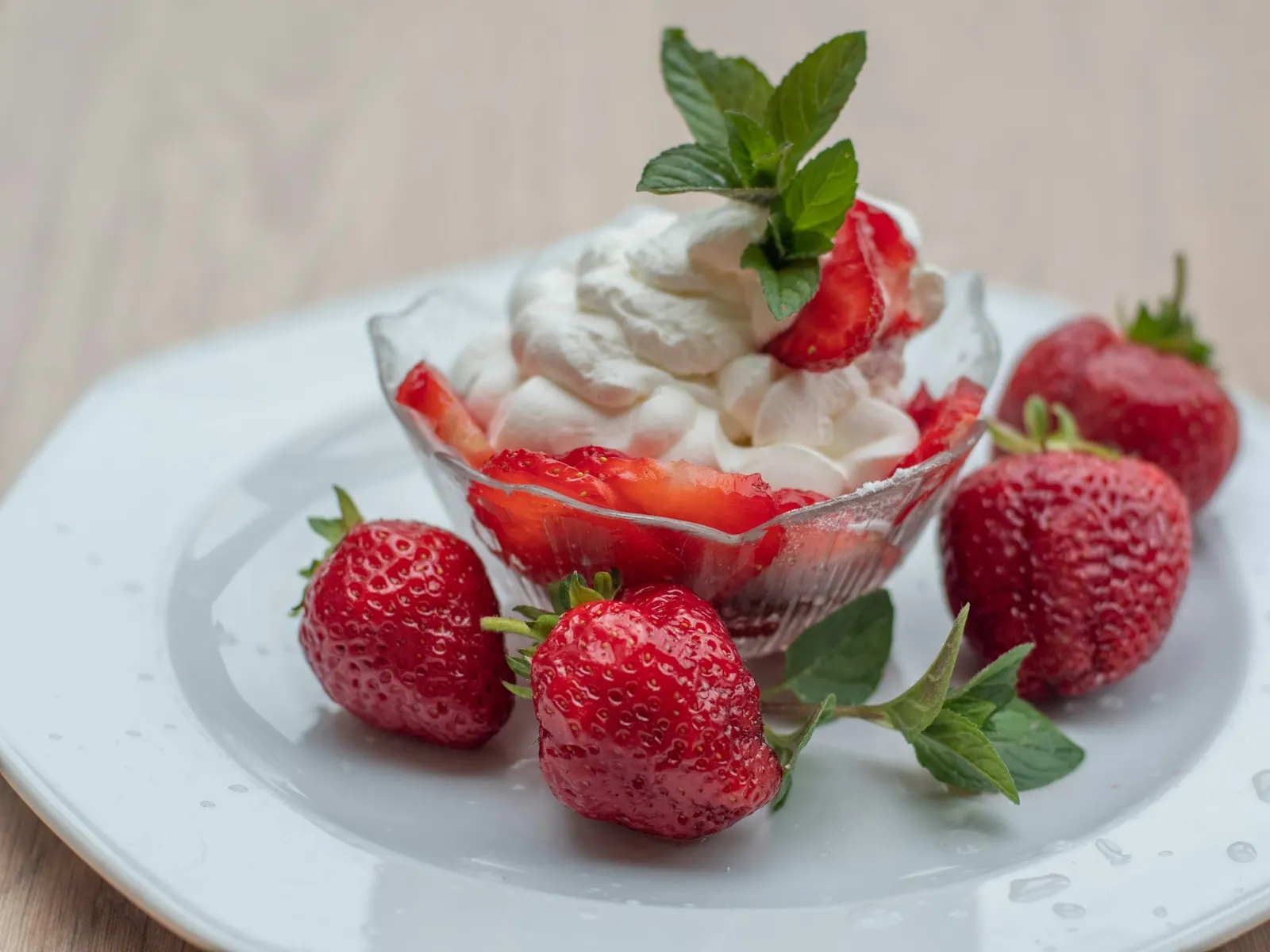 Bowl of strawberry protein fluff with fresh strawberries