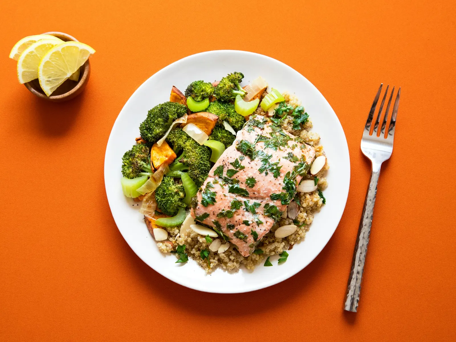 Salmon fillet with grains and roasted broccoli in a bowl